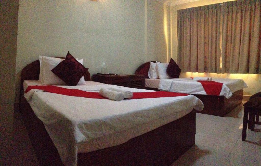 Homeland Guesthouse Phnom Penh Værelse billede
